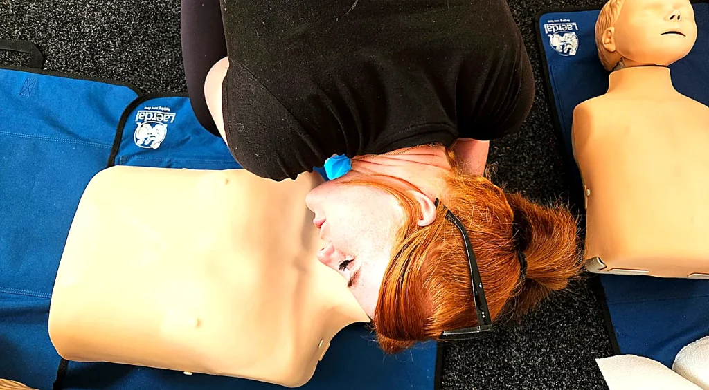 [Insert hero image - suggest CPR training or AED practice] Alt text: First aid training Newmarket – hands-on CPR practice during on-site workplace course